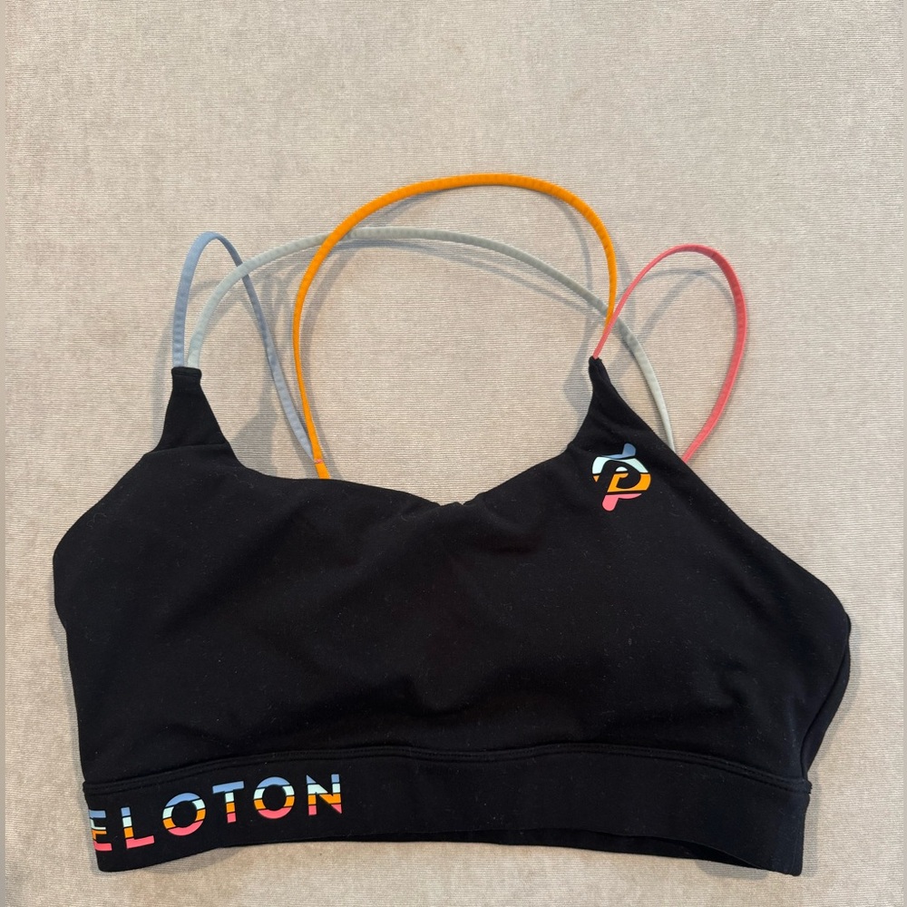 Black Peloton sports bra with colorful straps